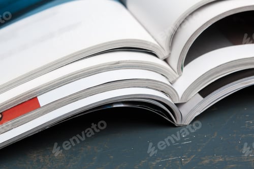 Preview: Close up stacking magazine place on table background