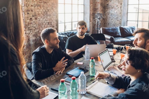 Preview: Designers having meeting in studio