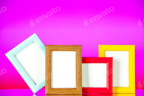 Preview: front view different picture frames with colored corners on light-pink background picture family