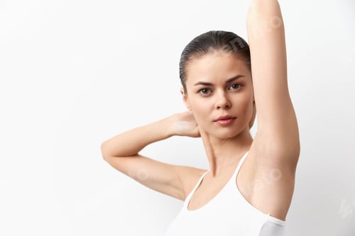 Preview: Young woman with sleek hair posing against a white background, showcasing graceful posture and