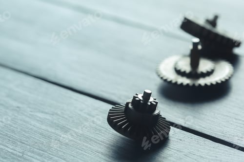 Preview: gears on the dark wooden background