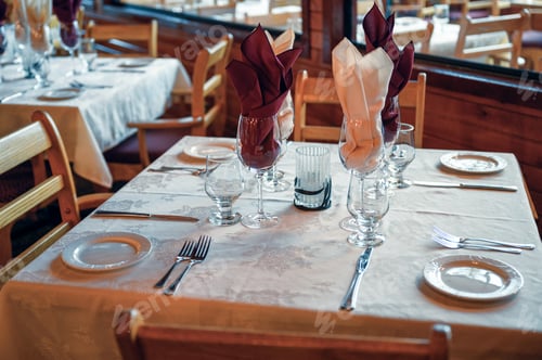 Preview: Rustic wooden dining table with tableware and glass