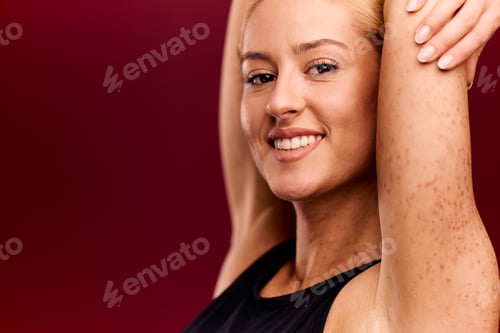 Preview: Close-up portrait of a pretty woman with spotted skin, looking happy and confident.