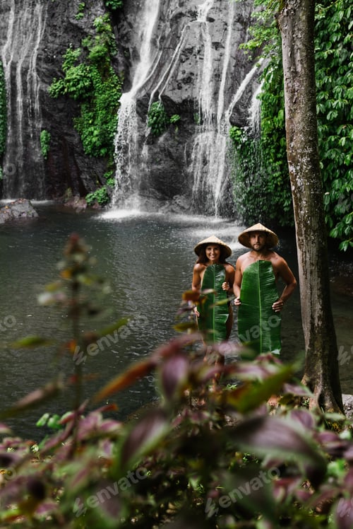 Preview: Couple among the greenery. A couple in love in the tropics. The couple is traveling in Asia