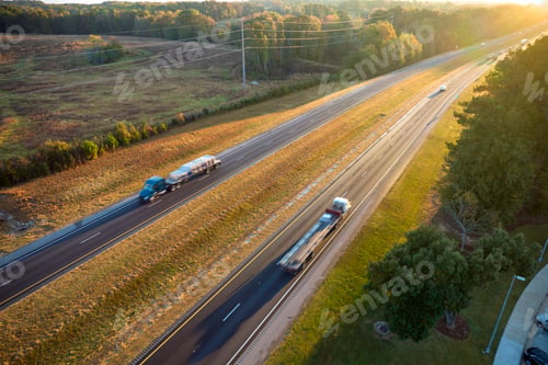 Preview: View from above of busy american highway with fast moving trucks and cars.
