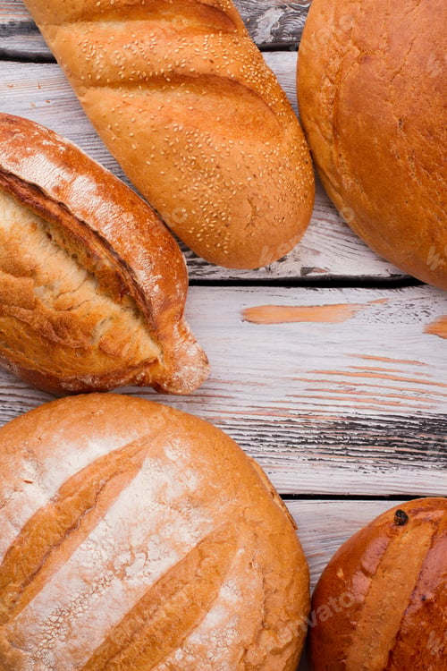 Preview: Bread frame of wooden background, top view.