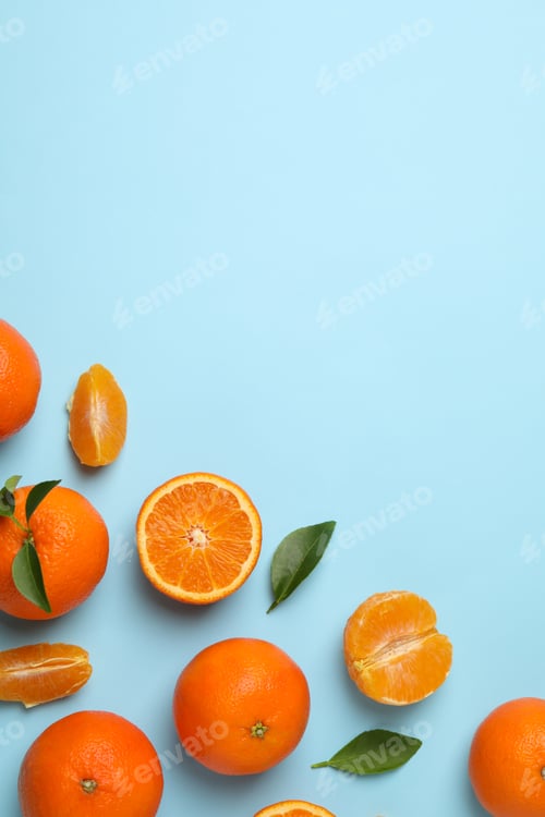 Preview: Ripe sweet mandarins on blue background, top view