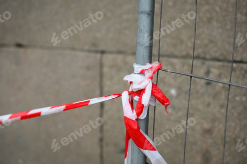 Preview: Red and white barrier tape in the street