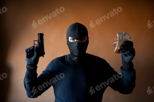 Preview: Image of a robber in balaclava with a gun in hand and a lot of money in another hand
