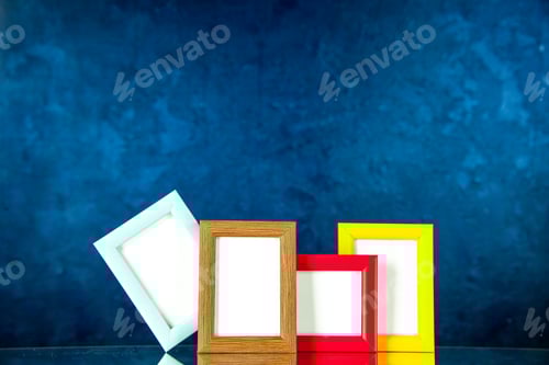 Preview: front view different picture frames with colored corners on dark-blue background present family