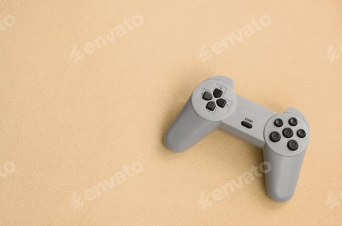 Preview: Playing games concept. Single pad joystick lies on the blanket of furry or