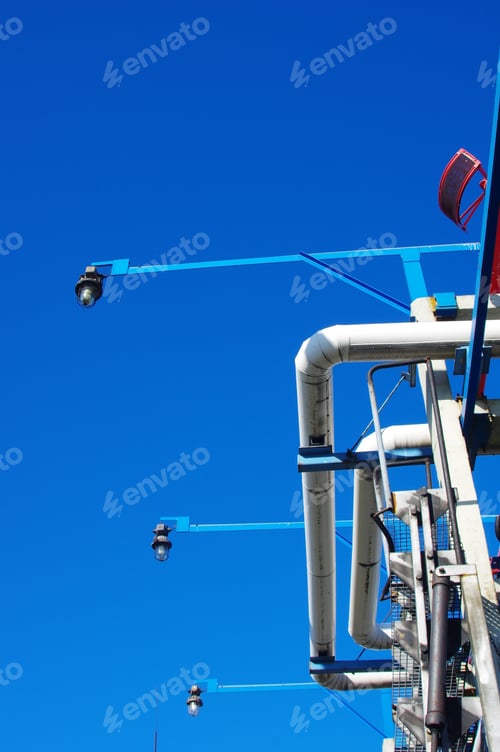 Preview: Vertical shot of an oil refinery plant with large industrial pipes