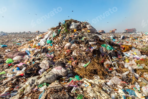 Preview: Closeup of burning trash piles in landfill with people recycling trash