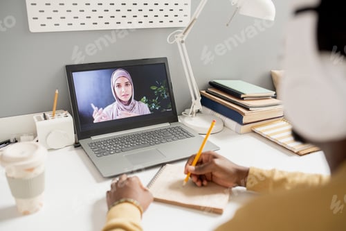 Preview: Remote Learning: Woman Online Tutoring Student Taking Notes