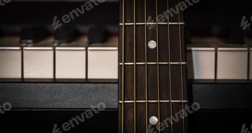 Preview: musical instruments piano keys and acoustic guitar