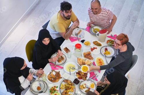 Preview: Top view of muslim family having Iftar during Ramadan holy month