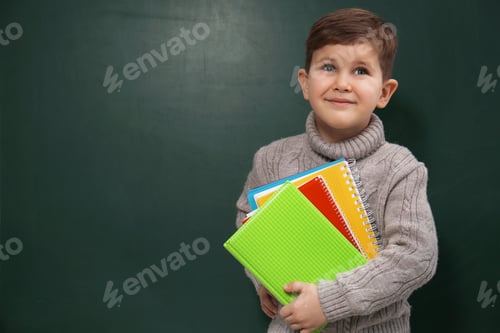 Preview: Cute little child near chalkboard, space for text. First time at school