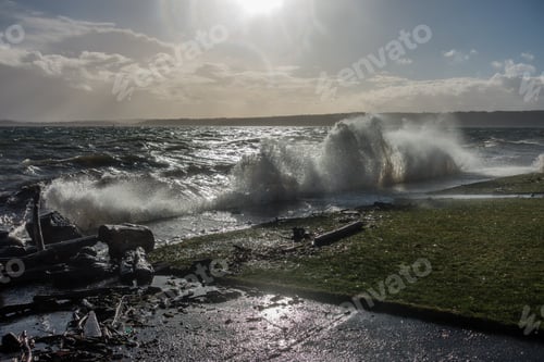 Preview: A Wave Explodes As It Hits A Sea Wall In Des Moines, Washington.