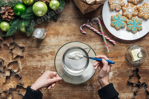 Preview: cropped shot of woman making dough for christmas cookies bakery on wooden tabletop with decorative