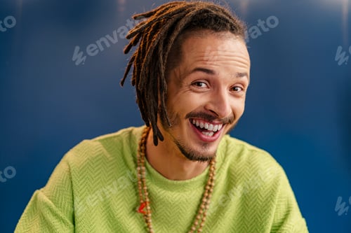 Preview: Portrait of a happy positive guy with dreadlocks