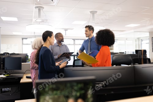 Preview: Happy diverse female and male businesspeople talking and working in office