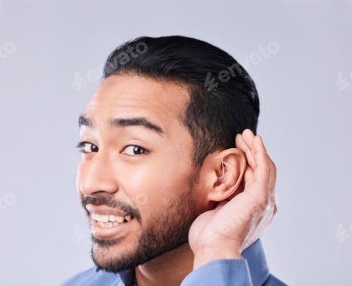 Preview: Deaf, portrait and asian man with hand on cochlear in studio for speak up, listen or communication