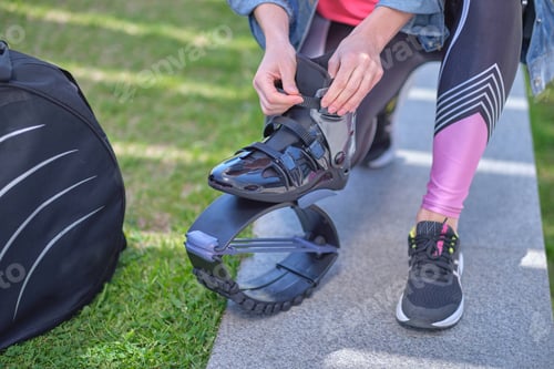 Preview: Fit legs in kangoo jumping shoes. womanpreparing for Kangoo Jumping training