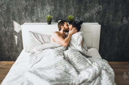Preview: Man and woman in bed. Guy and girl have sex. Couple in love in bed. Wedding night