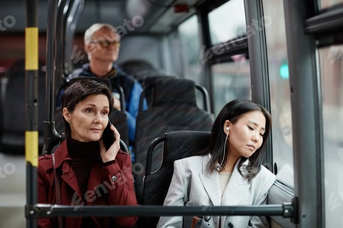 Preview: Two Women Traveling by Bus in City