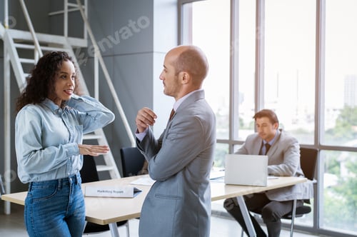 Preview: young business people discussing and brainstorming at modern office