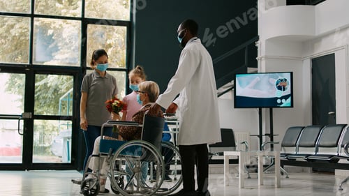 Preview: Little girl visiting senior woman in wheelchair