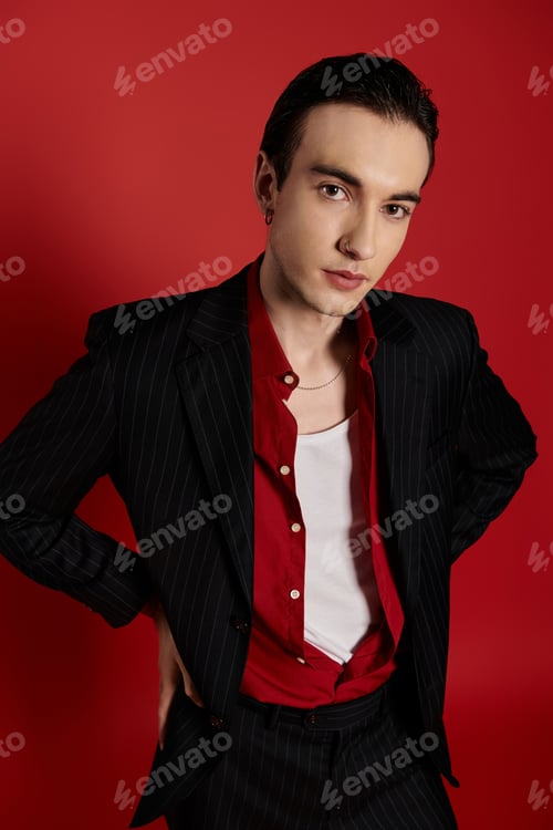 Preview: Elegant Man in Red and Black Against a Vibrant Red Backdrop