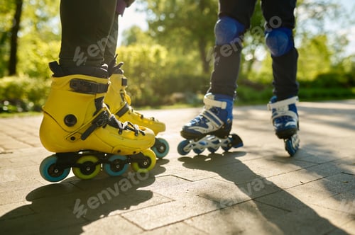 Preview: Cropped shot of man and boy legs wearing rollerblades