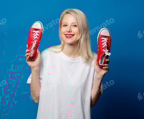 Preview: Blonde in white t-shirt with red gumshoes on blue background