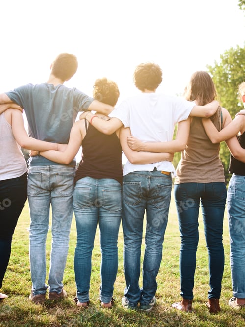 Preview: large group of friends holding each other in a late summer day