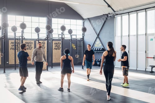 Preview: Group of people training in gym
