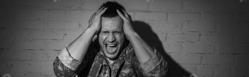 Preview: Black and white photo of stressed military veteran screaming while suffering from post traumatic