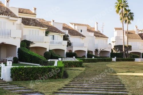 Preview: House, building and architecture concept - Street of large suburban homes in summer