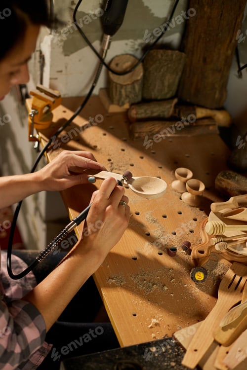 Preview: Female using power working tools graver for wooden utensils spoon