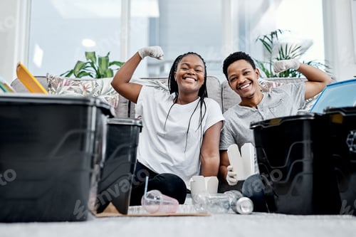 Preview: Less litter makes the world better. Shot of a young couple recycling their trash at home.