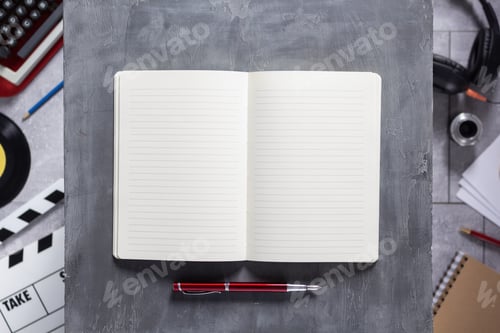 Preview: Empty paper notebook and pen as creative concept. Movie and screenwriter or composer concept