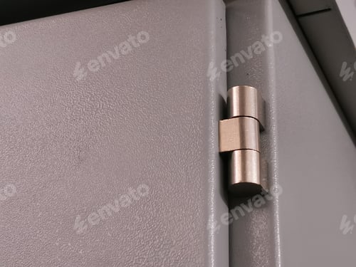 Preview: Selective focus on close up image of electrical cabinet door with hinges.