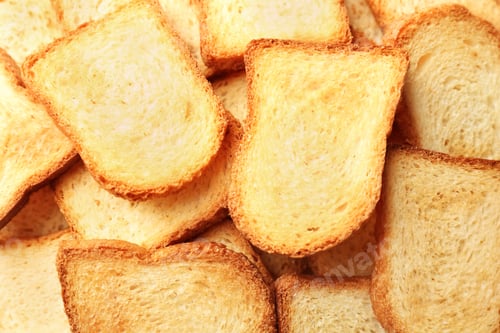 Preview: Toasted slices of bread as background, closeup