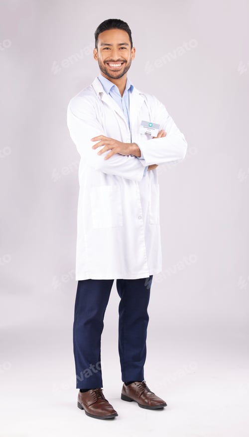 Preview: Portrait, man and happy scientist with arms crossed in studio isolated on a white background. Confi
