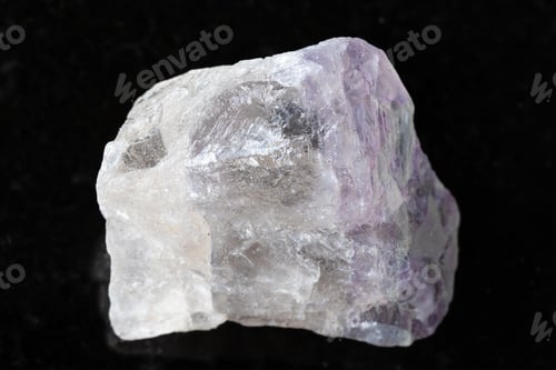 Preview: sample of unpolished fluorite rock on black