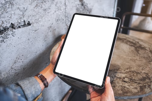Preview: Mockup image of a woman holding digital tablet with blank white desktop screen