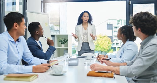 Preview: Shot of a young businesswoman giving a presentation to her staff
