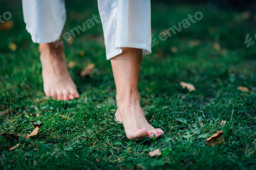 Preview: Yoga Woman Walking barefoot, focus on feet.