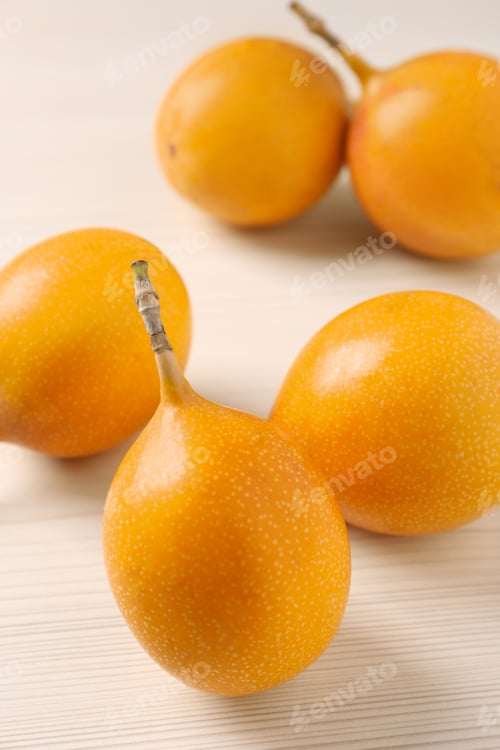 Preview: Delicious ripe granadillas on white wooden table, closeup