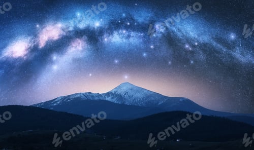 Preview: Milky Way over Goverla mountain with snow covered peak at night